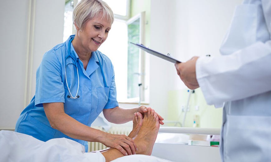 nurse treating feet